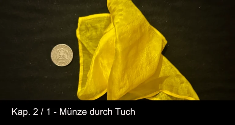 muenze_durch_tuch